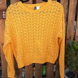 Divided loose knit womens yellow sweater.